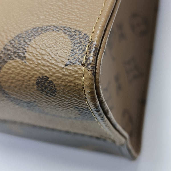 ONTHEGO PM Monogram Coated Canvas Brown