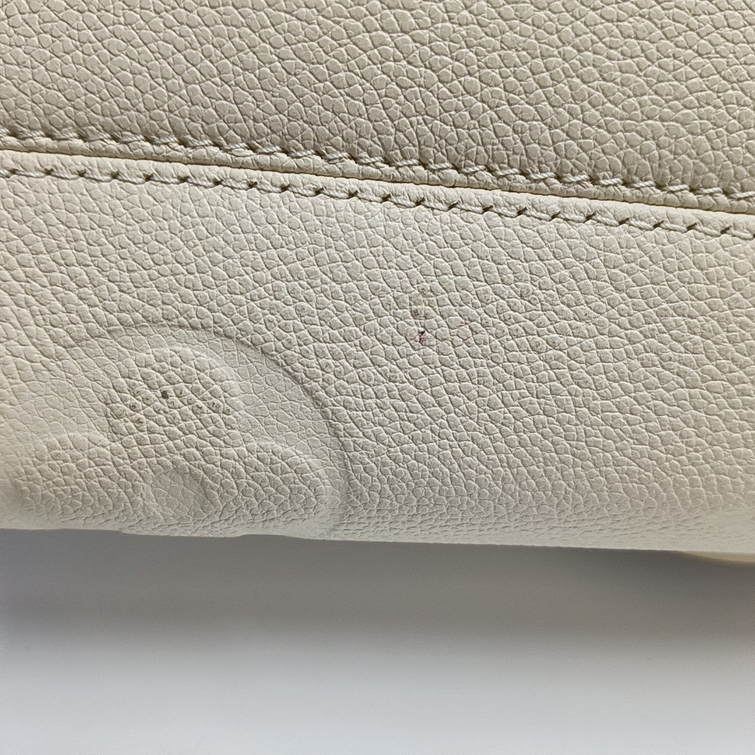 ONTHEGO EAST WEST Monogram Calfskin Beige