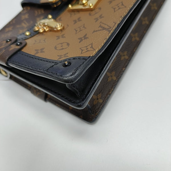 TRUNK Monogram Coated Canvas Brown
