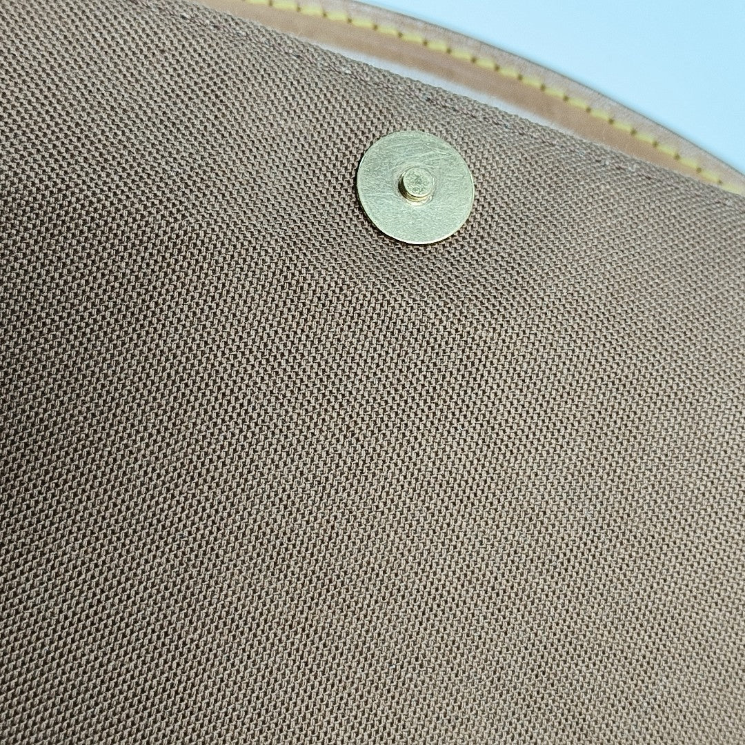LOOPING PM Monogram Coated Canvas Brown
