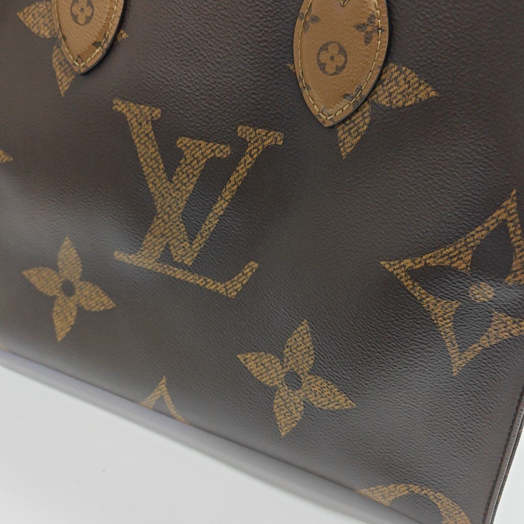 ONTHEGO MM Monogram Coated Canvas Brown
