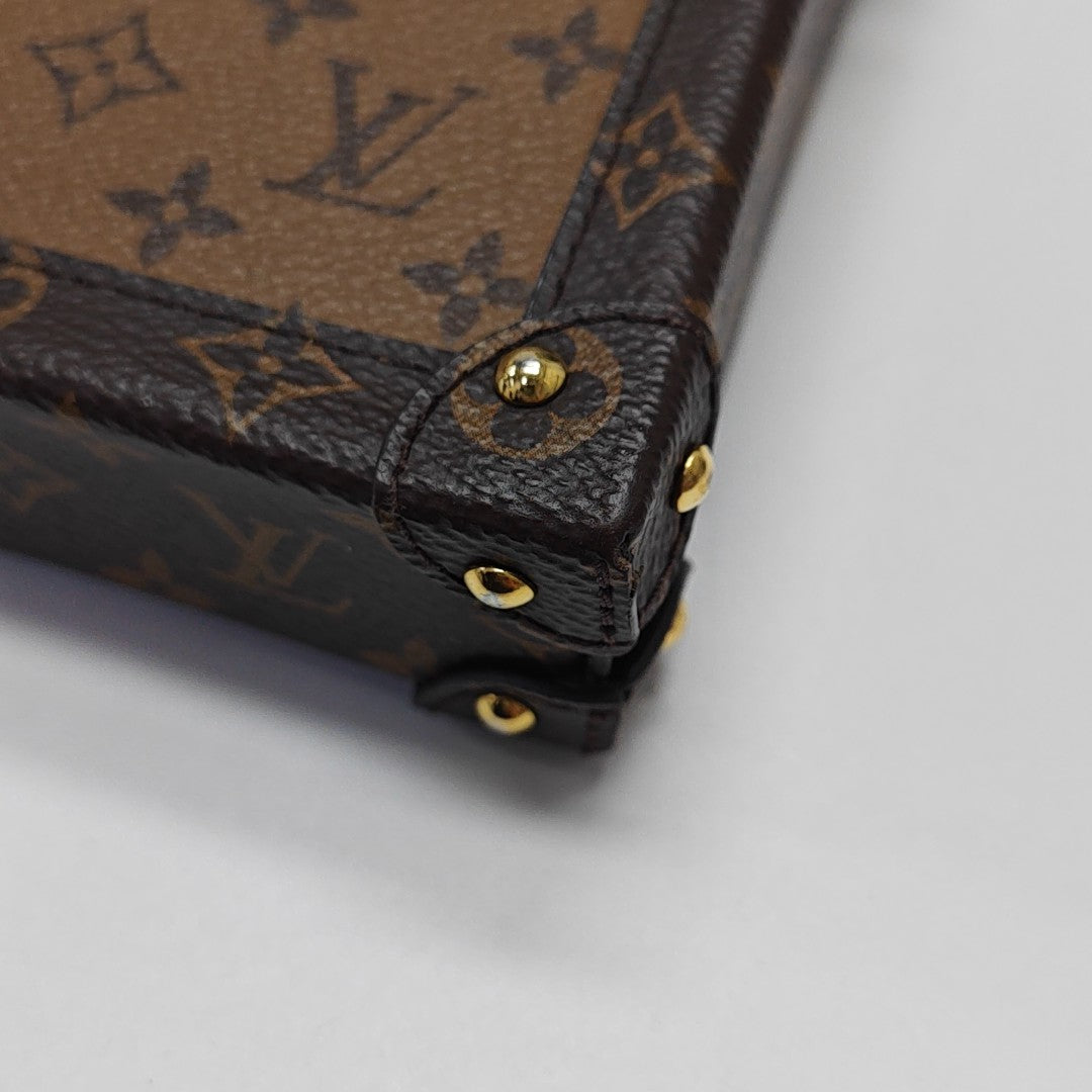 TRUNK Monogram Coated Canvas Brown