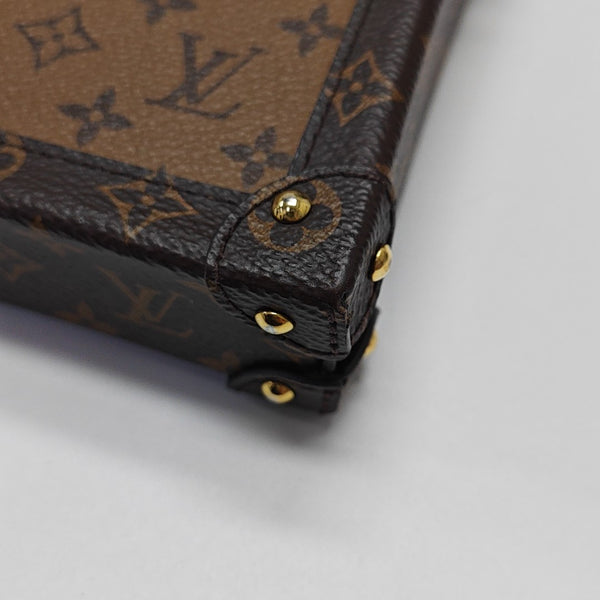 TRUNK Monogram Coated Canvas Brown