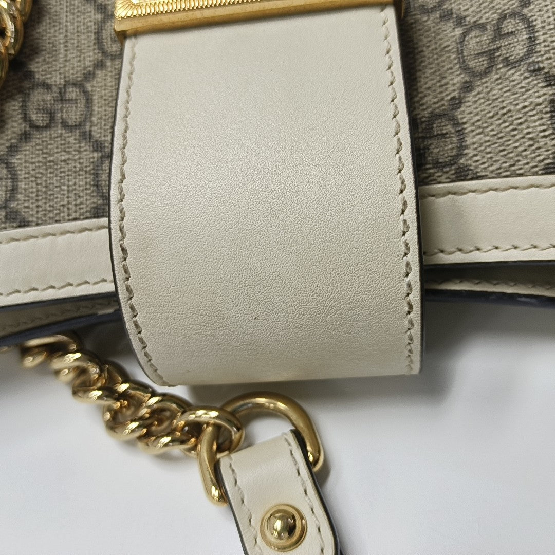 Padlock Small Monogram Coated Canvas Beige