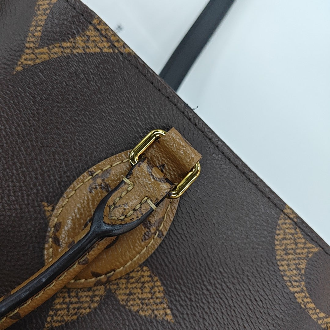 ONTHEGO MM Monogram Coated Canvas Brown