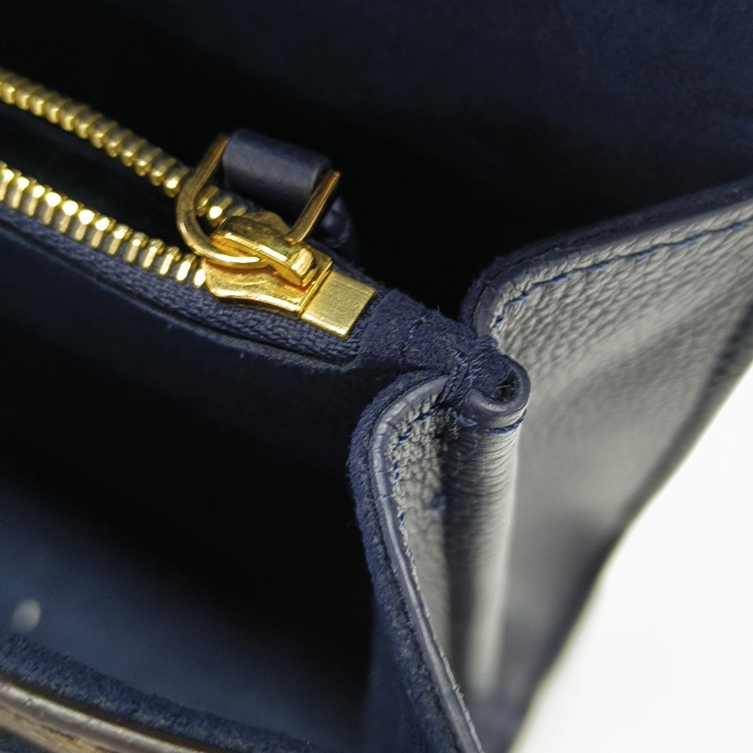 VICTOIRE Monogram Coated Canvas Brown