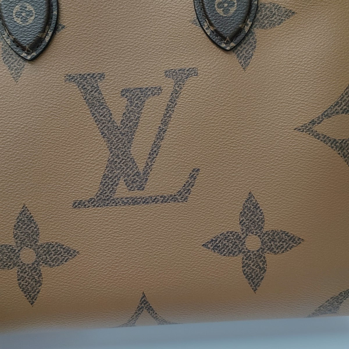 ONTHEGO MM Monogram Coated Canvas Brown