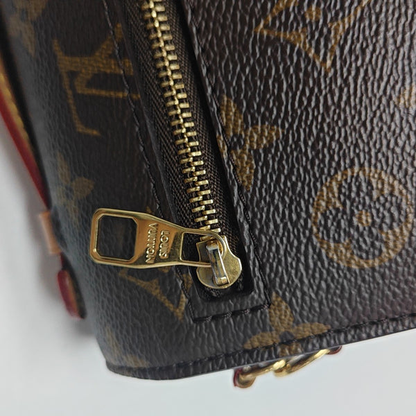 MÉTIS EAST WEST Monogram Coated Canvas Brown