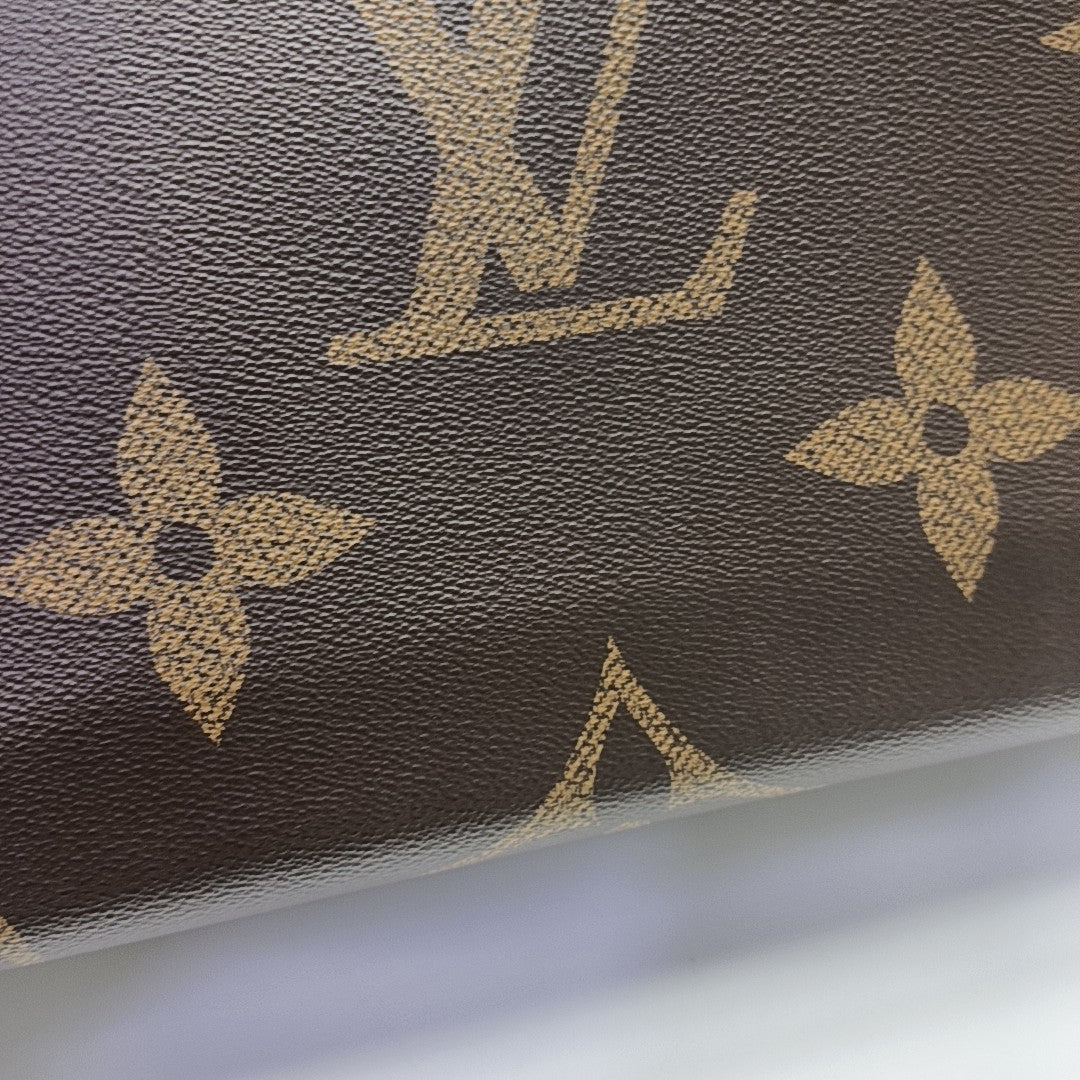 ONTHEGO GM Monogram Coated Canvas Brown