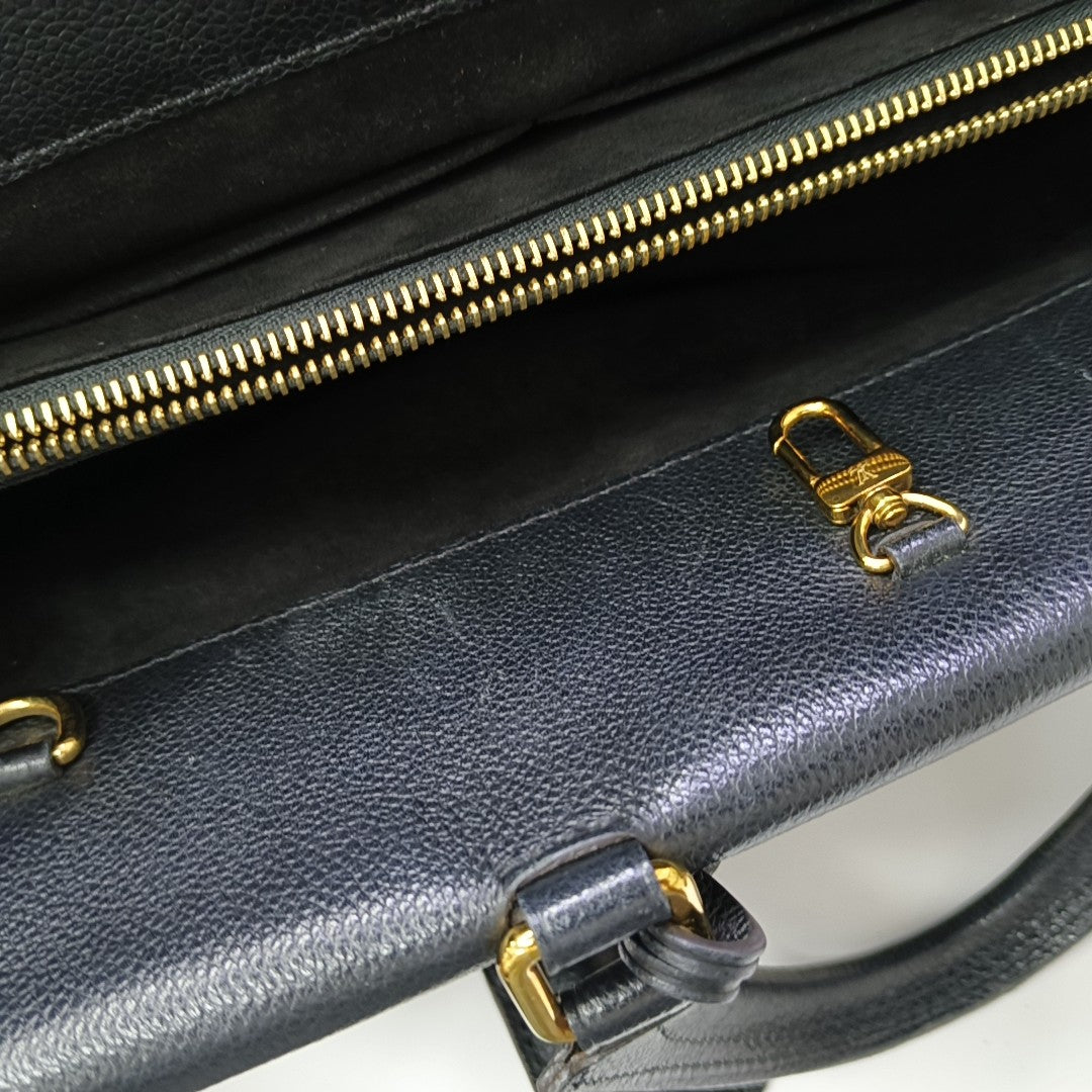 VÉNUS Monogram Coated Canvas Brown