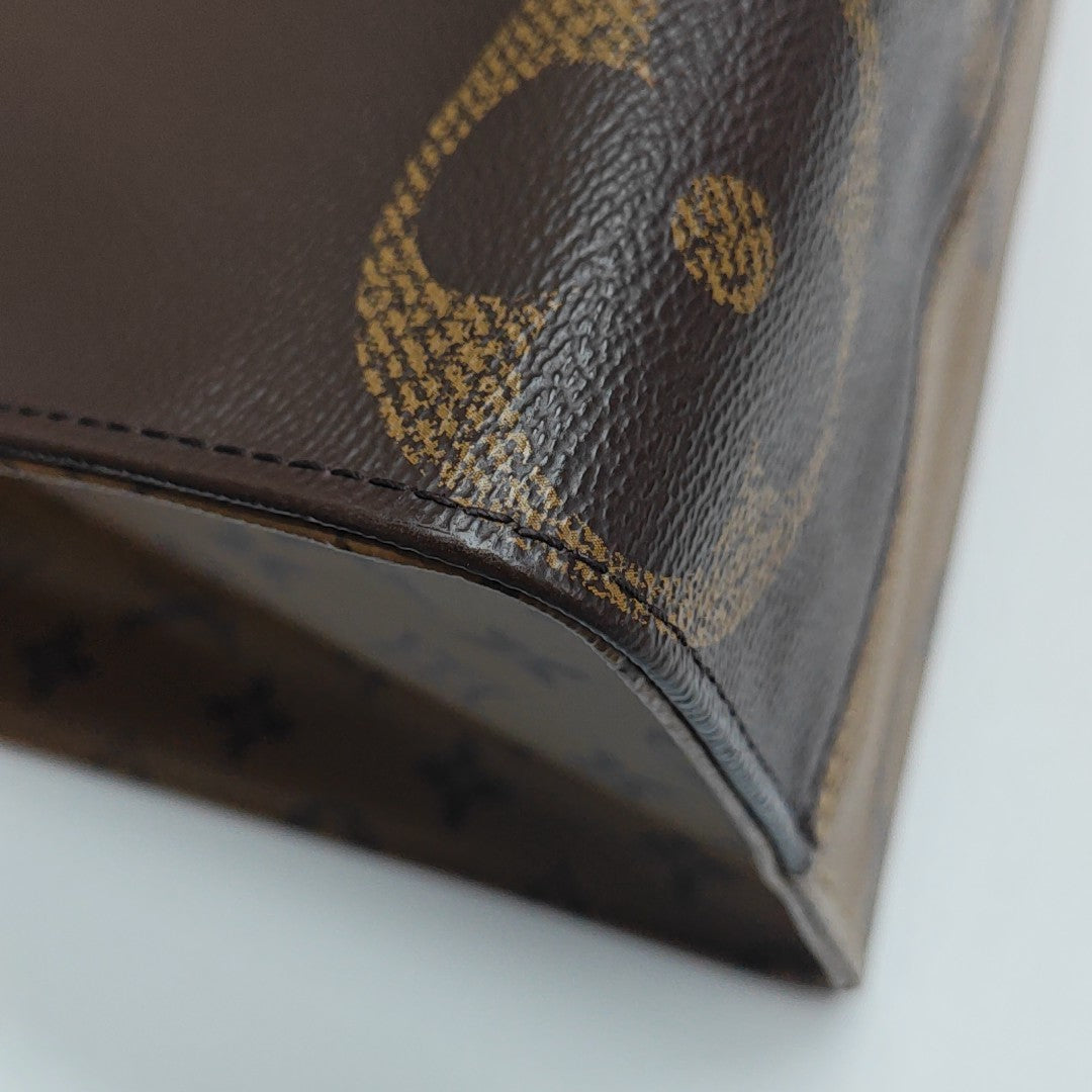 ONTHEGO MM Monogram Coated Canvas Brown