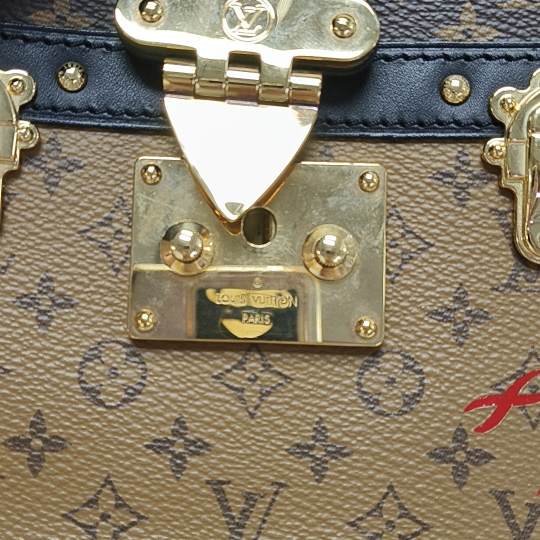 TRUNK Monogram Coated Canvas Brown