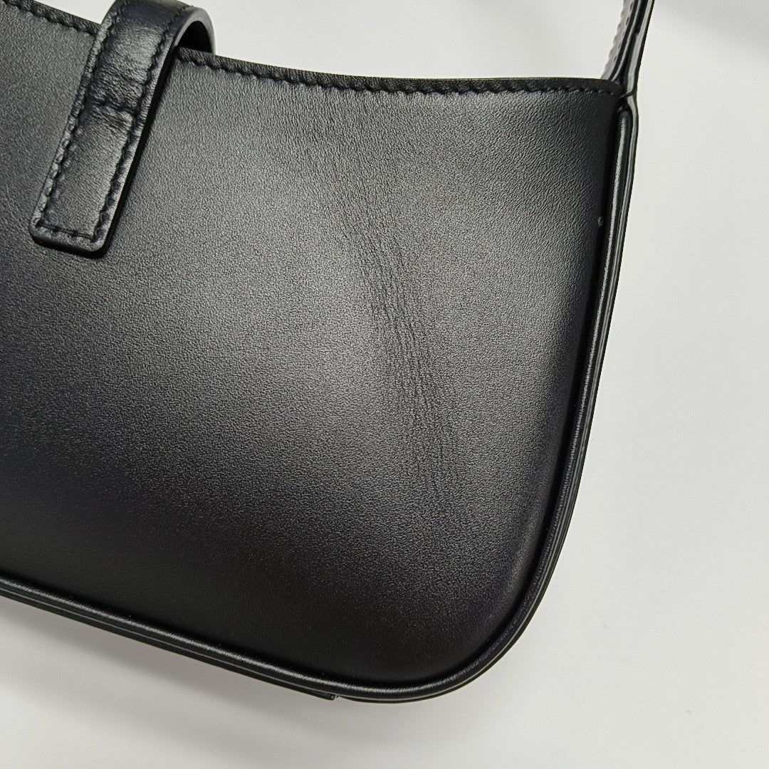 Authenticated pre-owned  LE 5 À 7 Calfskin Black - Top Handle Bag at Looply