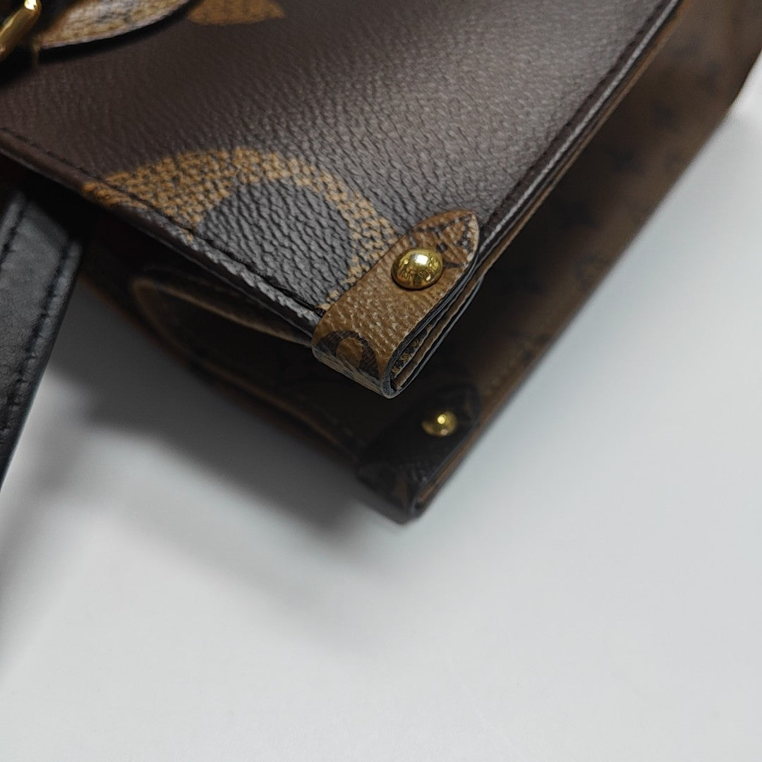 ONTHEGO MM Monogram Coated Canvas Brown