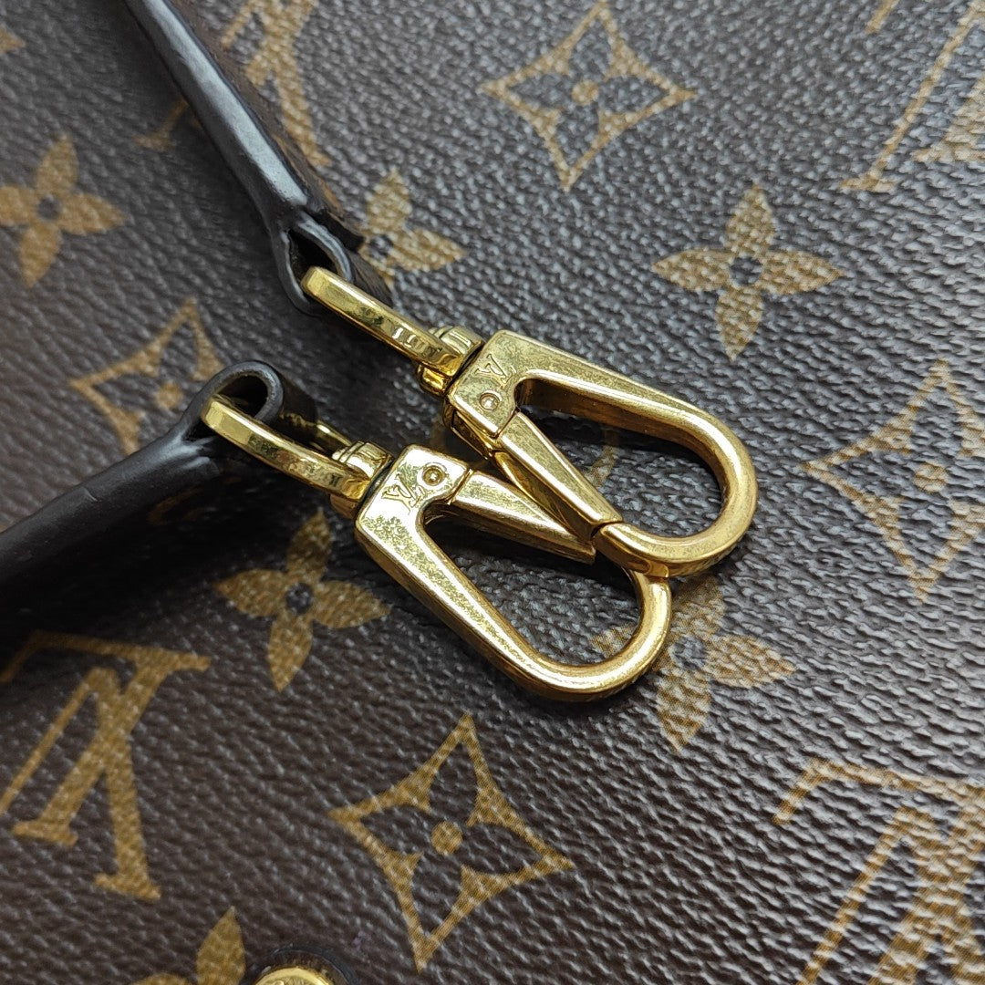 MONTAIGNE GM Monogram Coated Canvas Brown