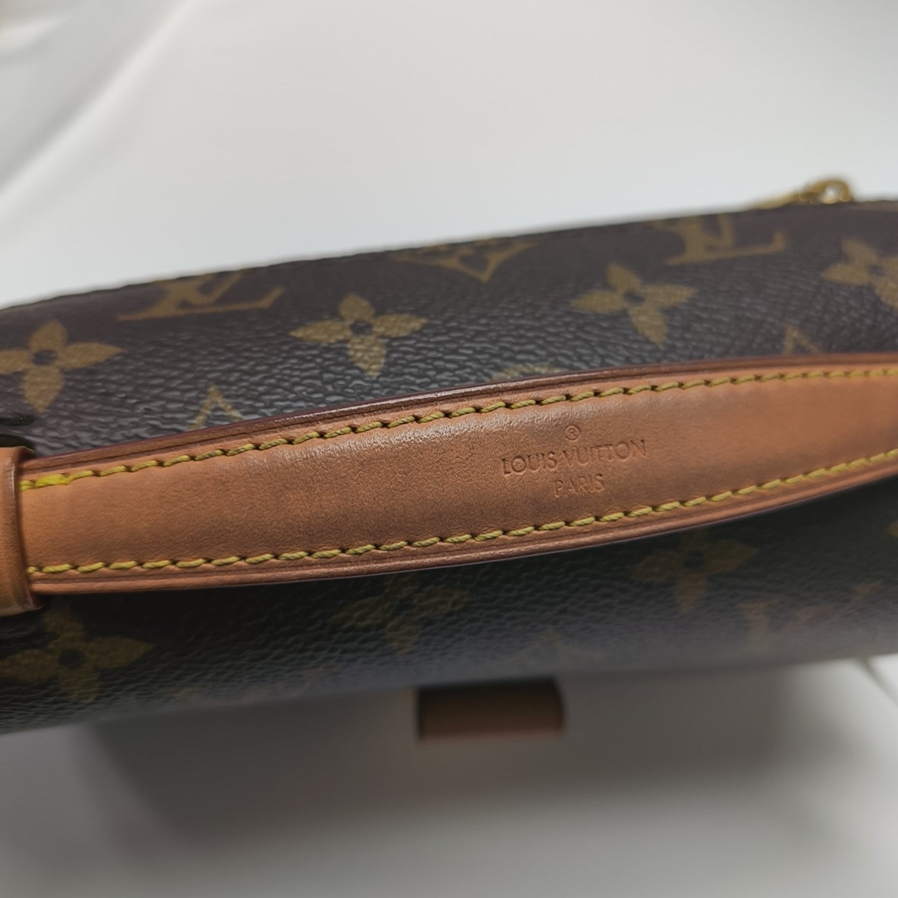 MÉTIS EAST WEST Monogram Coated Canvas Brown