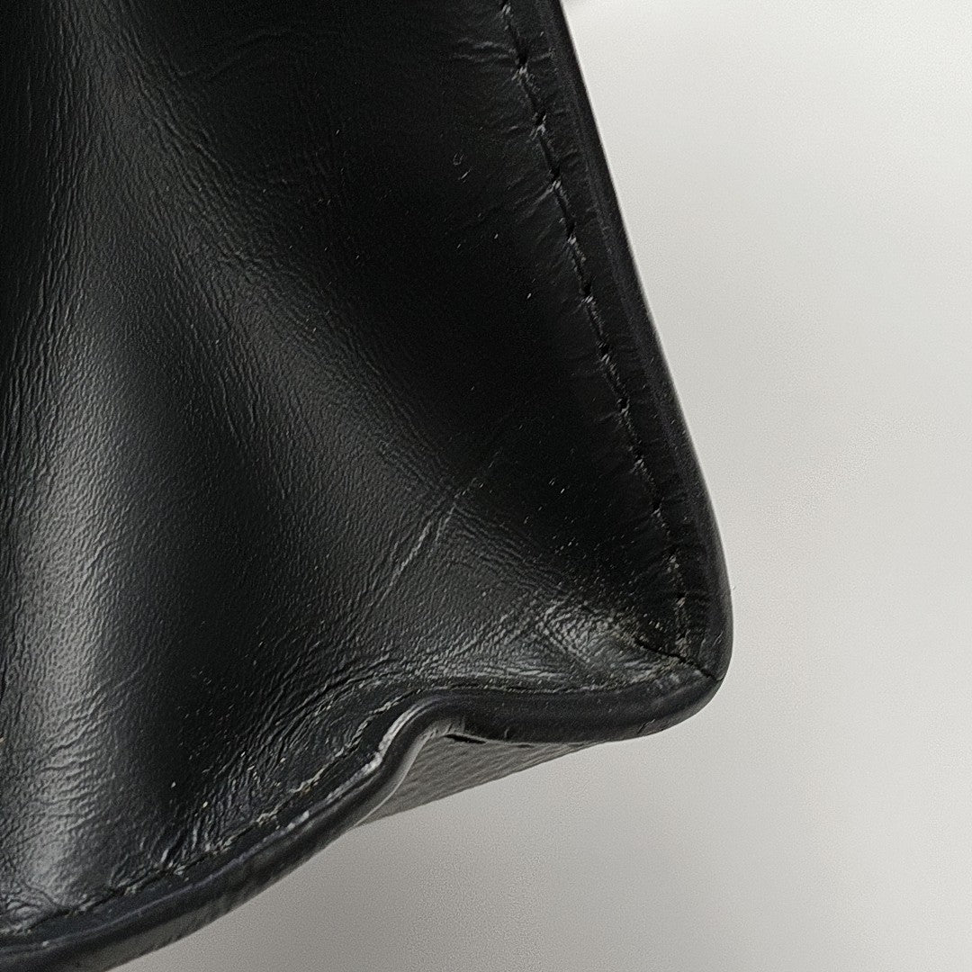 Pochette Voyag MM Monogram Coated Canvas Black