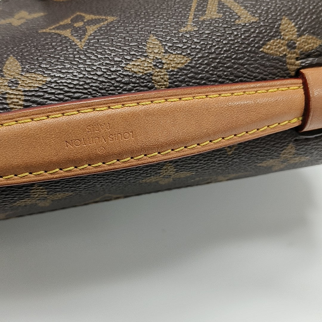 MÉTIS EAST WEST Monogram Coated Canvas Brown
