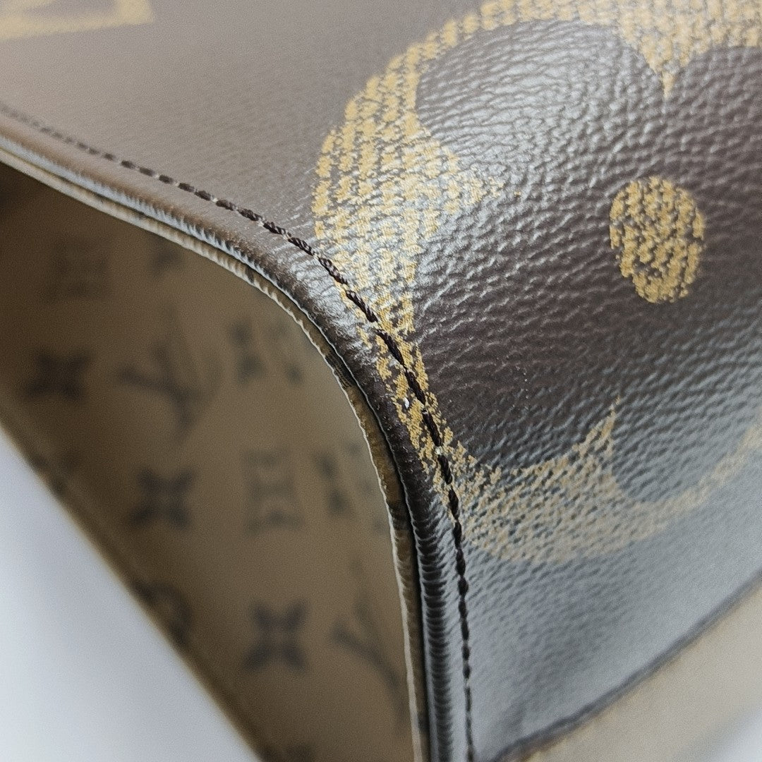 ONTHEGO MM Monogram Coated Canvas Brown