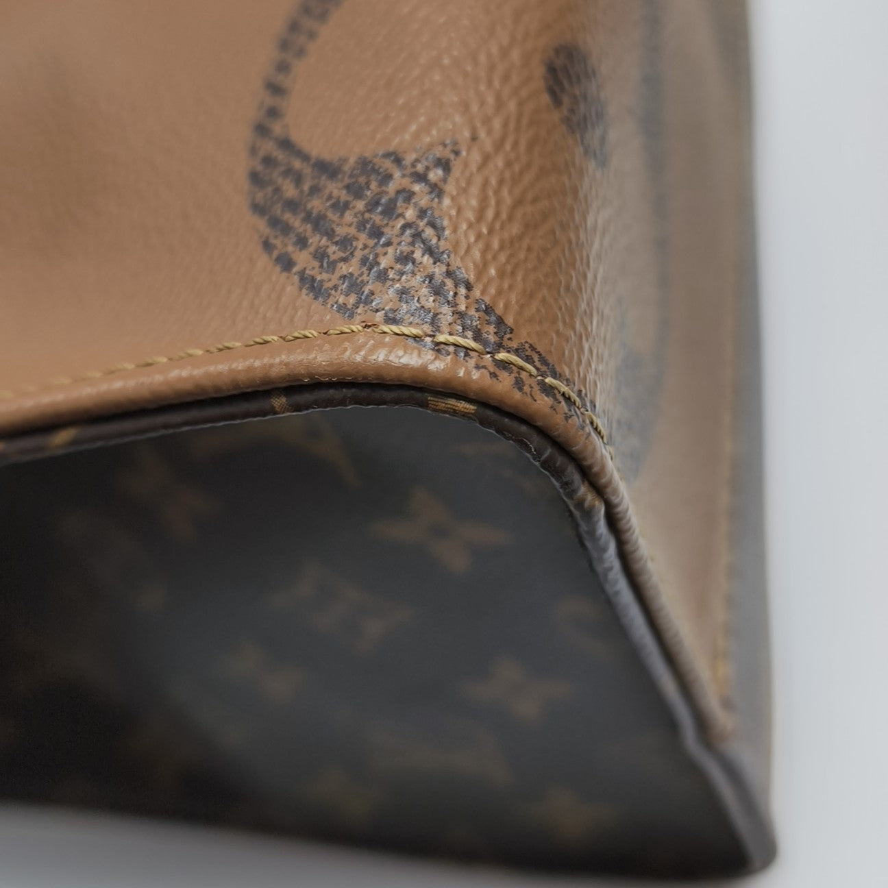 ONTHEGO MM Monogram Coated Canvas Brown