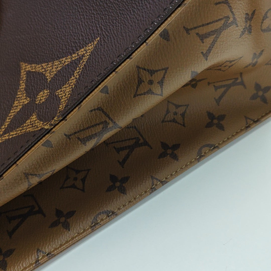 ONTHEGO MM Monogram Coated Canvas Brown