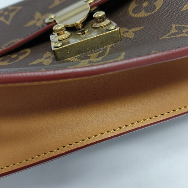 S LOCK Monogram Coated Canvas Brown