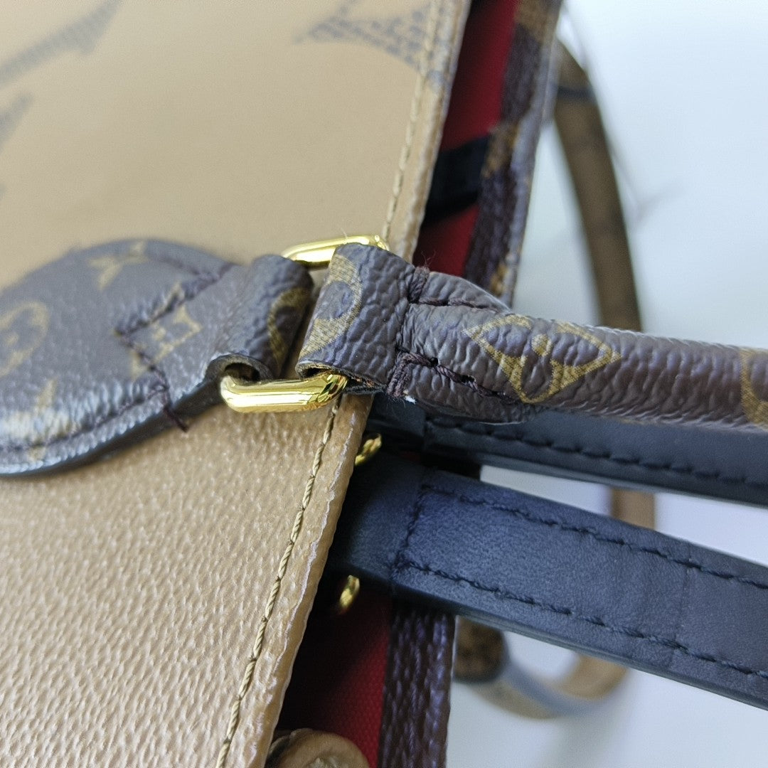 ONTHEGO MM Monogram Coated Canvas Brown