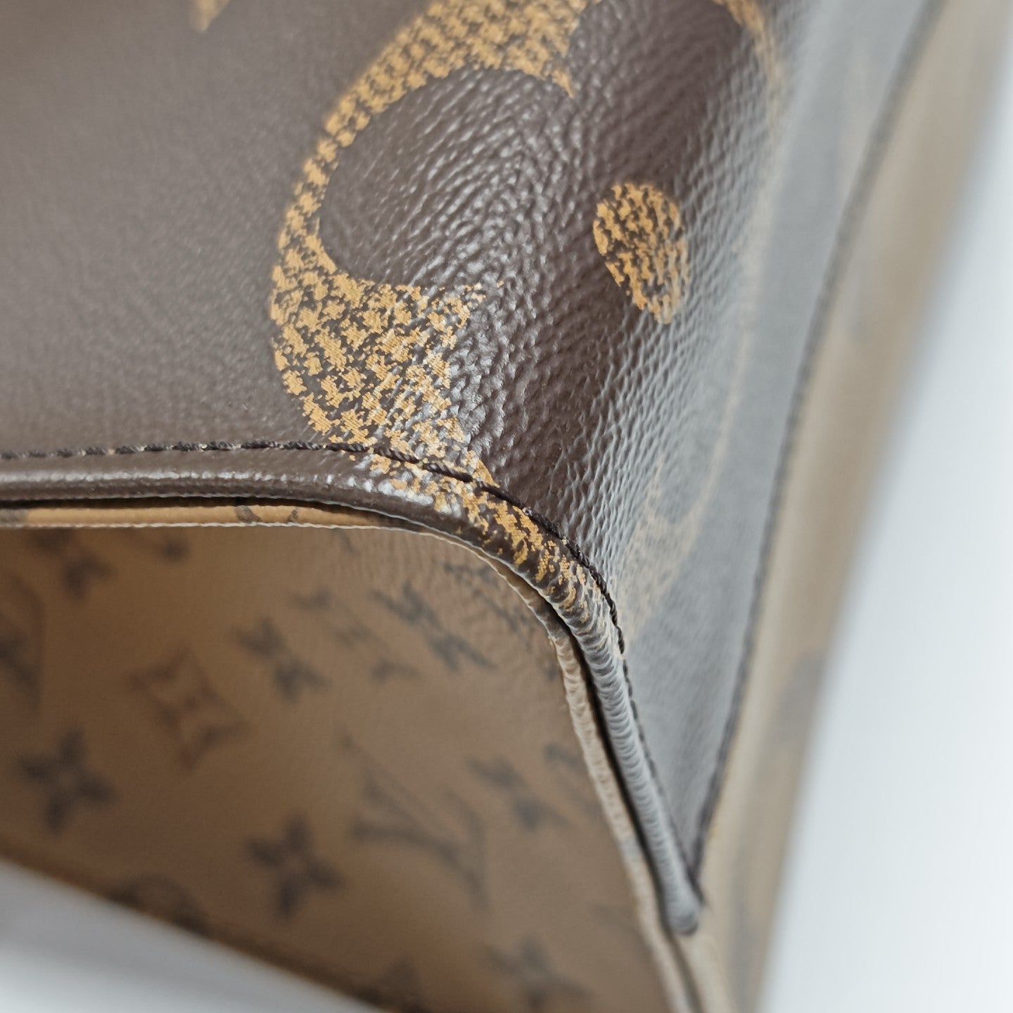 ONTHEGO MM Monogram Coated Canvas Brown