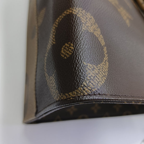 ONTHEGO MM Monogram Coated Canvas Brown