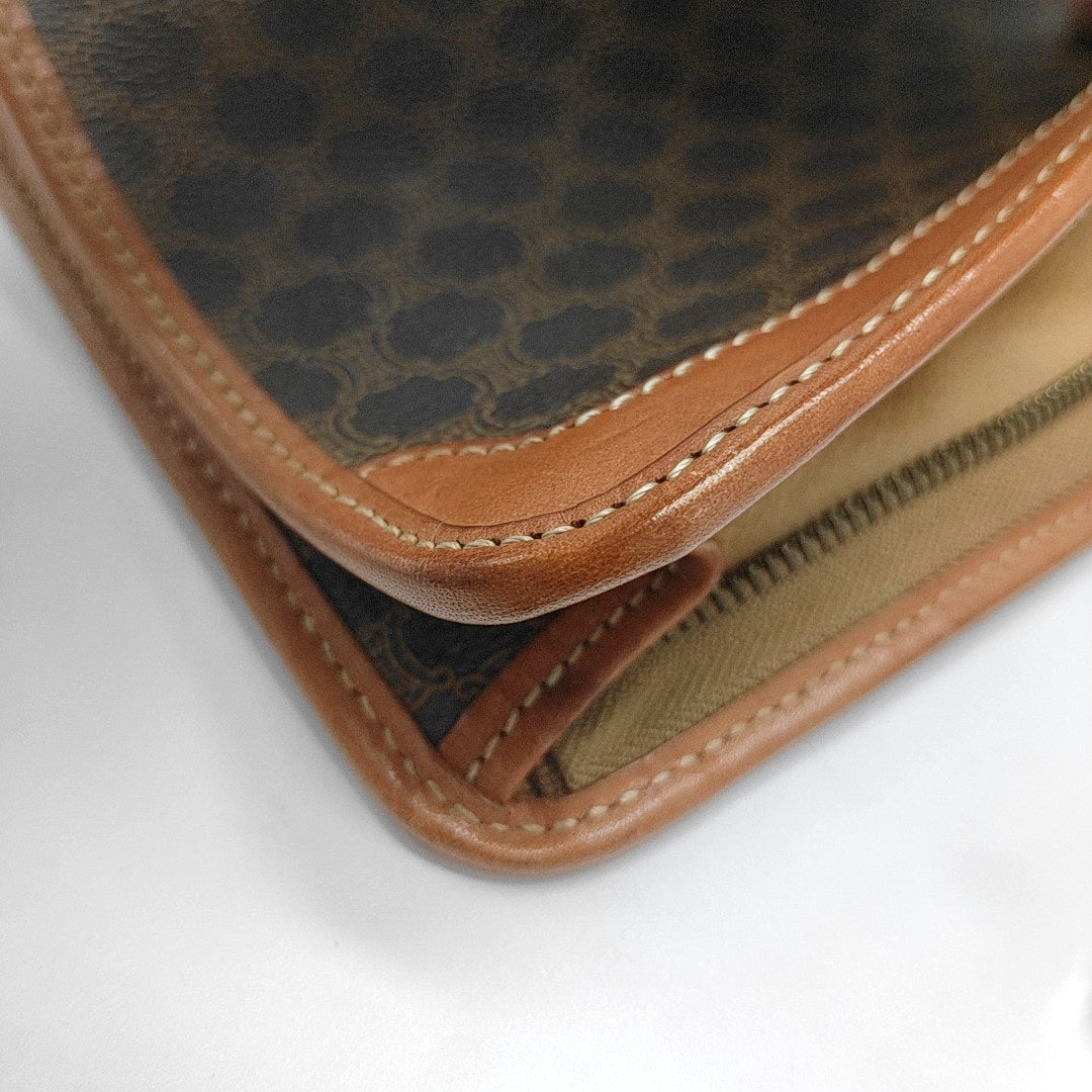 Authenticated pre-owned  MACADAM CLUTCHE Coated Canvas Brown - Clutch at Looply