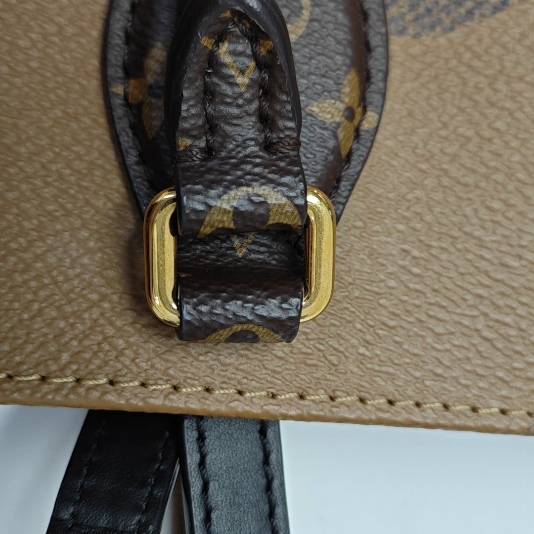 ONTHEGO MM Monogram Coated Canvas Brown