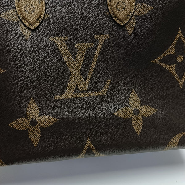 ONTHEGO MM Monogram Coated Canvas Brown