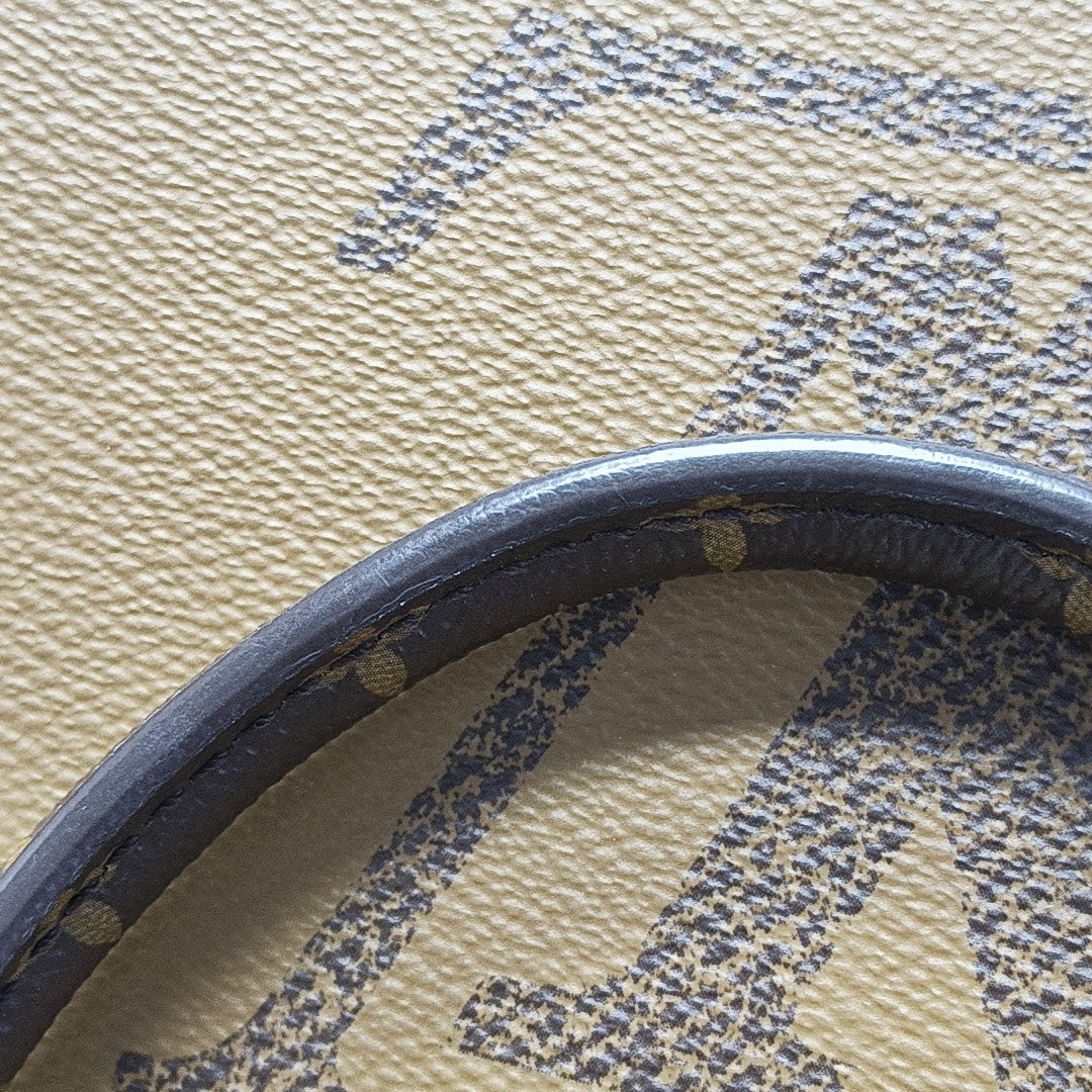 ONTHEGO MM Monogram Coated Canvas Brown