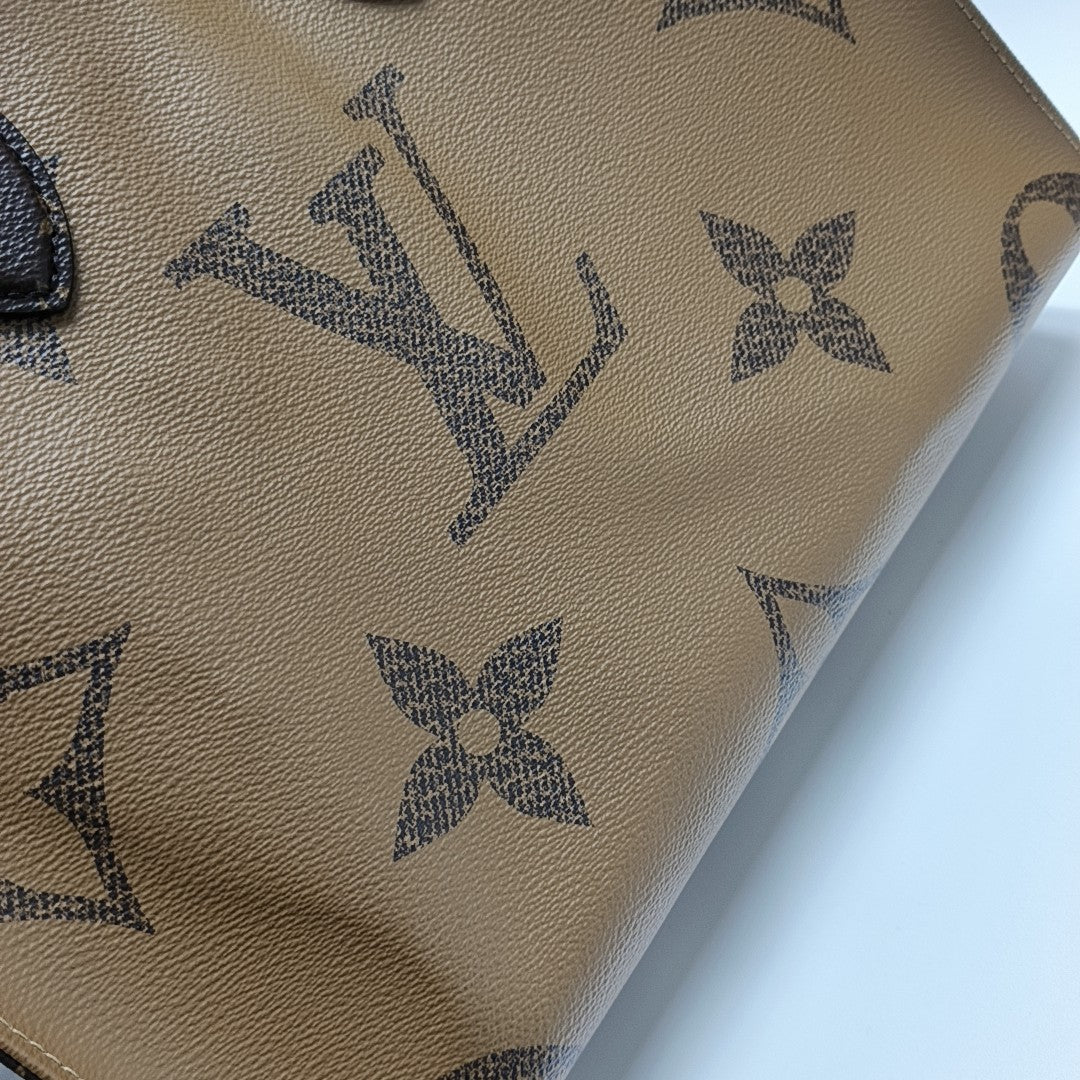 ONTHEGO MM Monogram Coated Canvas Brown