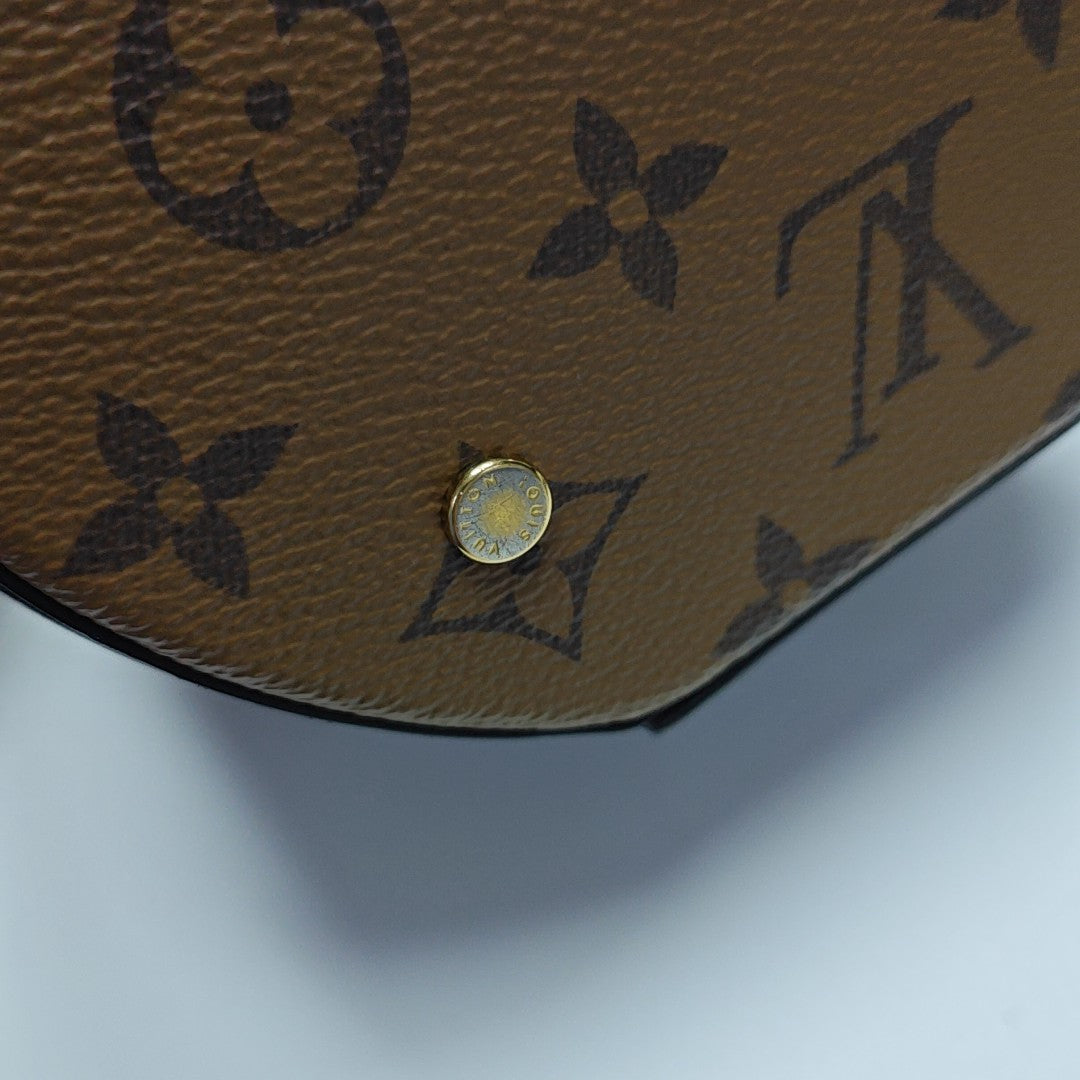 CANNES PM Monogram Coated Canvas Brown