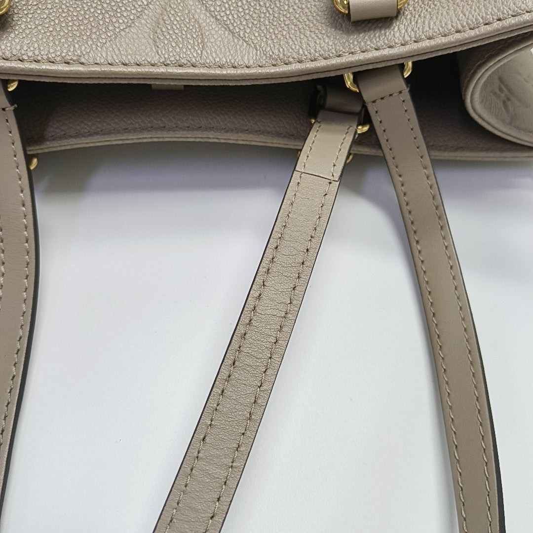 Authenticated pre-owned  ONTHEGO MM Monogram Calfskin Grey - Tote Bag at Looply