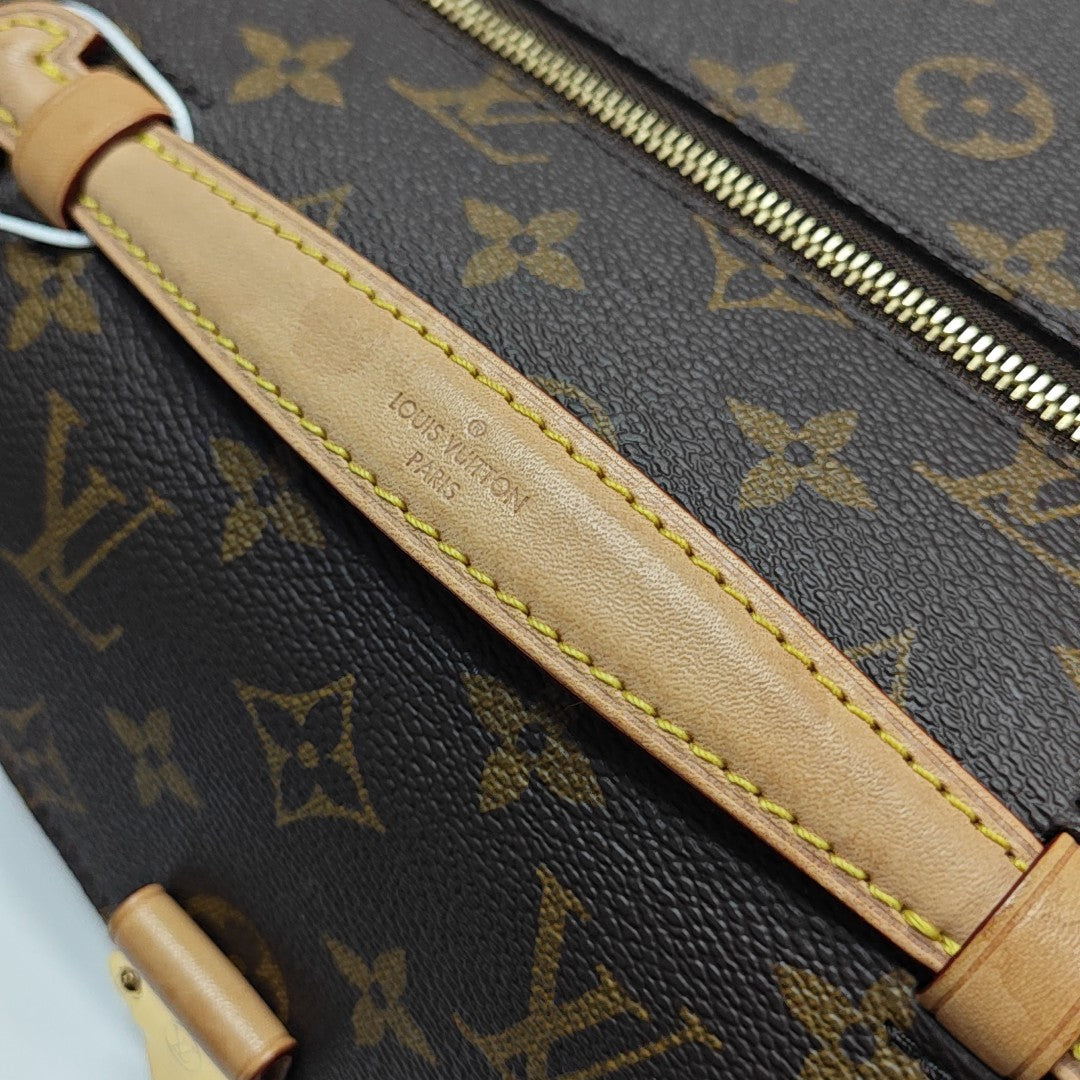 MÉTIS EAST WEST Monogram Coated Canvas Brown