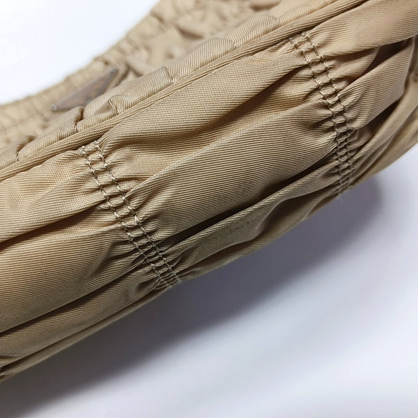 Authenticated pre-owned  Re-Edition2005 Mini Quilted Nylon Beige - Top Handle Bag at Looply