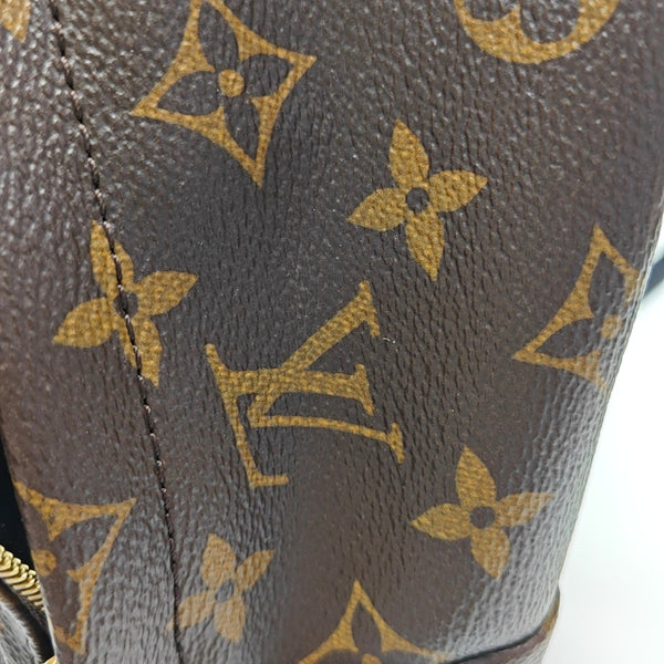 Authenticated pre-owned  PALM SPRINGS Mini Monogram Coated Canvas Brown - Backpack at Looply