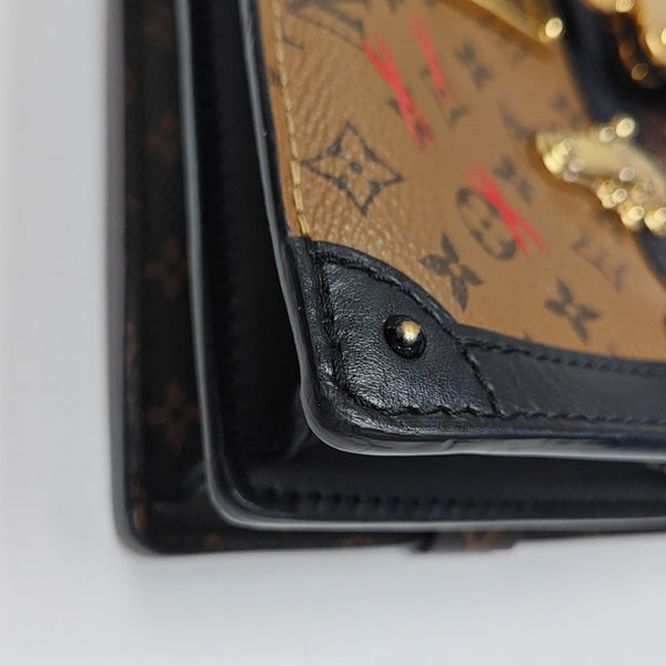 TRUNK Monogram Coated Canvas Brown