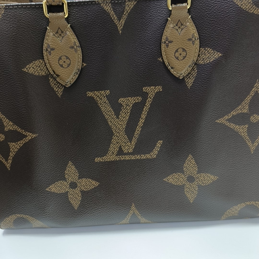 ONTHEGO MM Monogram Coated Canvas Brown