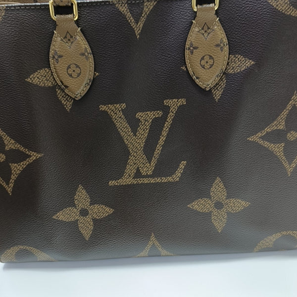 ONTHEGO MM Monogram Coated Canvas Brown