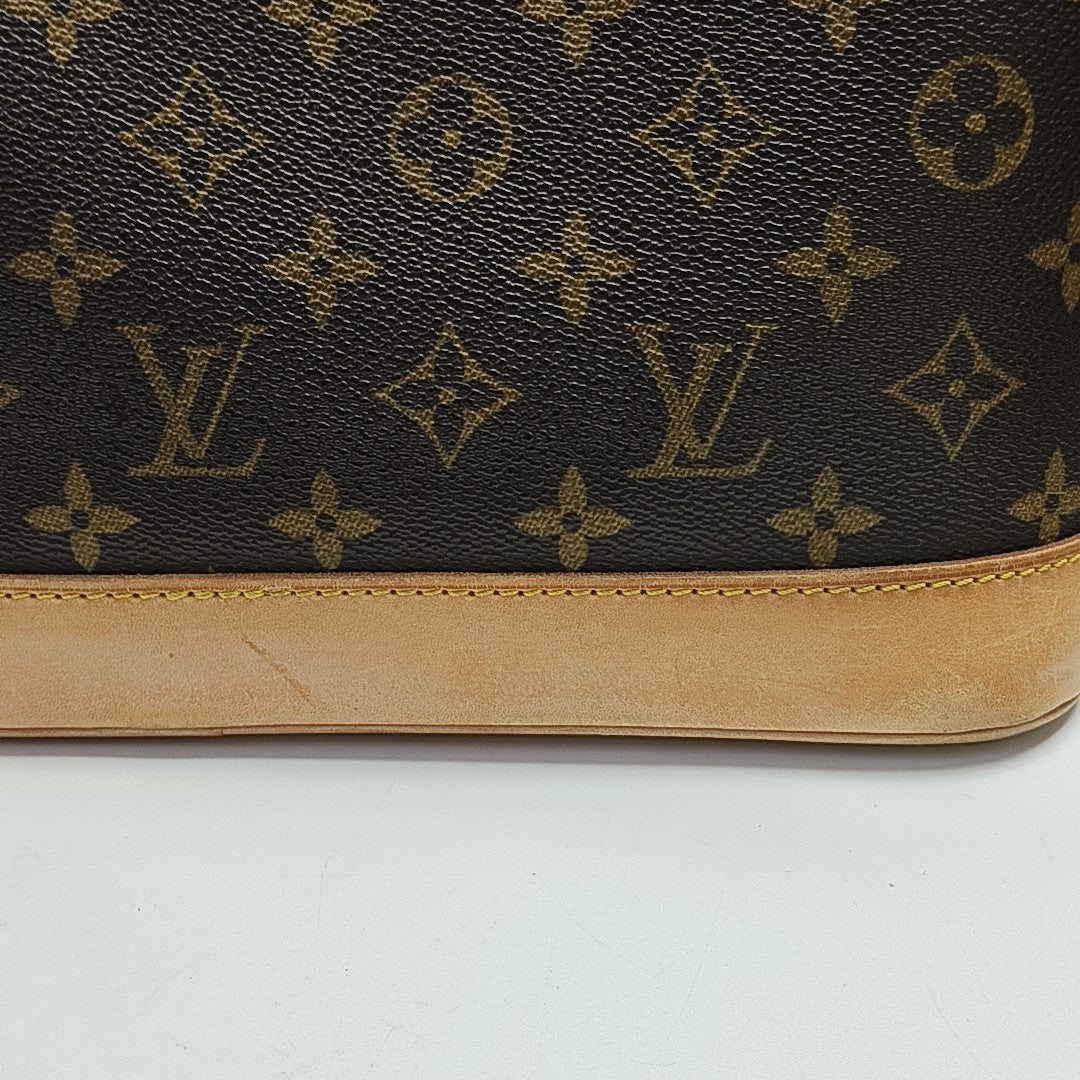 ALMA PM Monogram Coated Canvas Brown