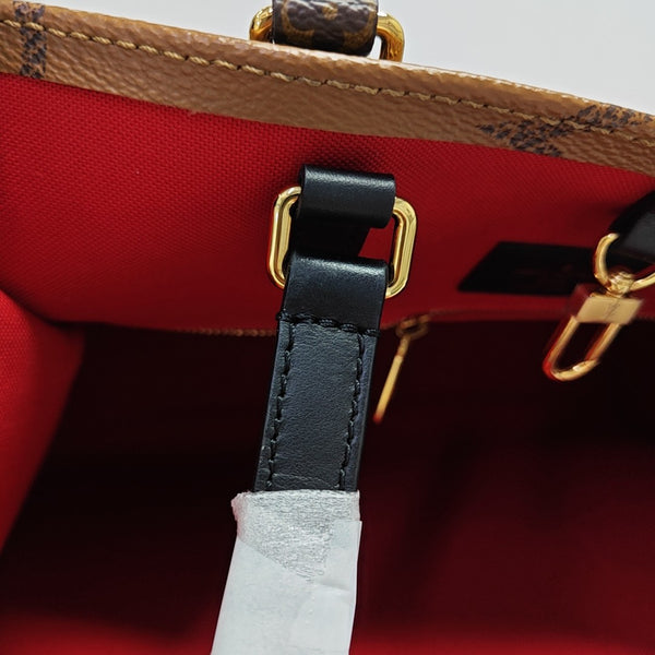 ONTHEGO MM Monogram Coated Canvas Brown
