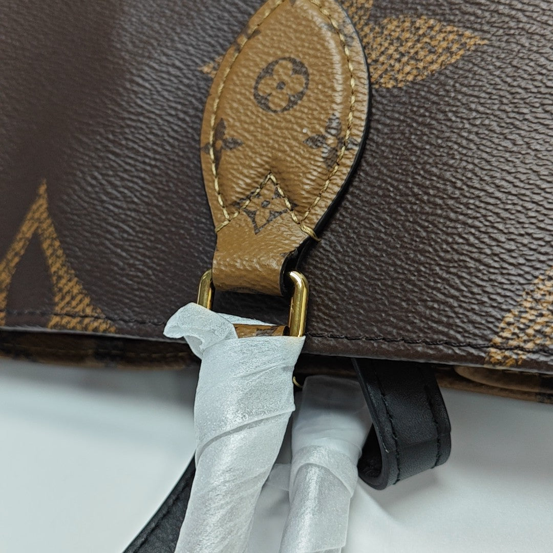 ONTHEGO MM Monogram Coated Canvas Brown