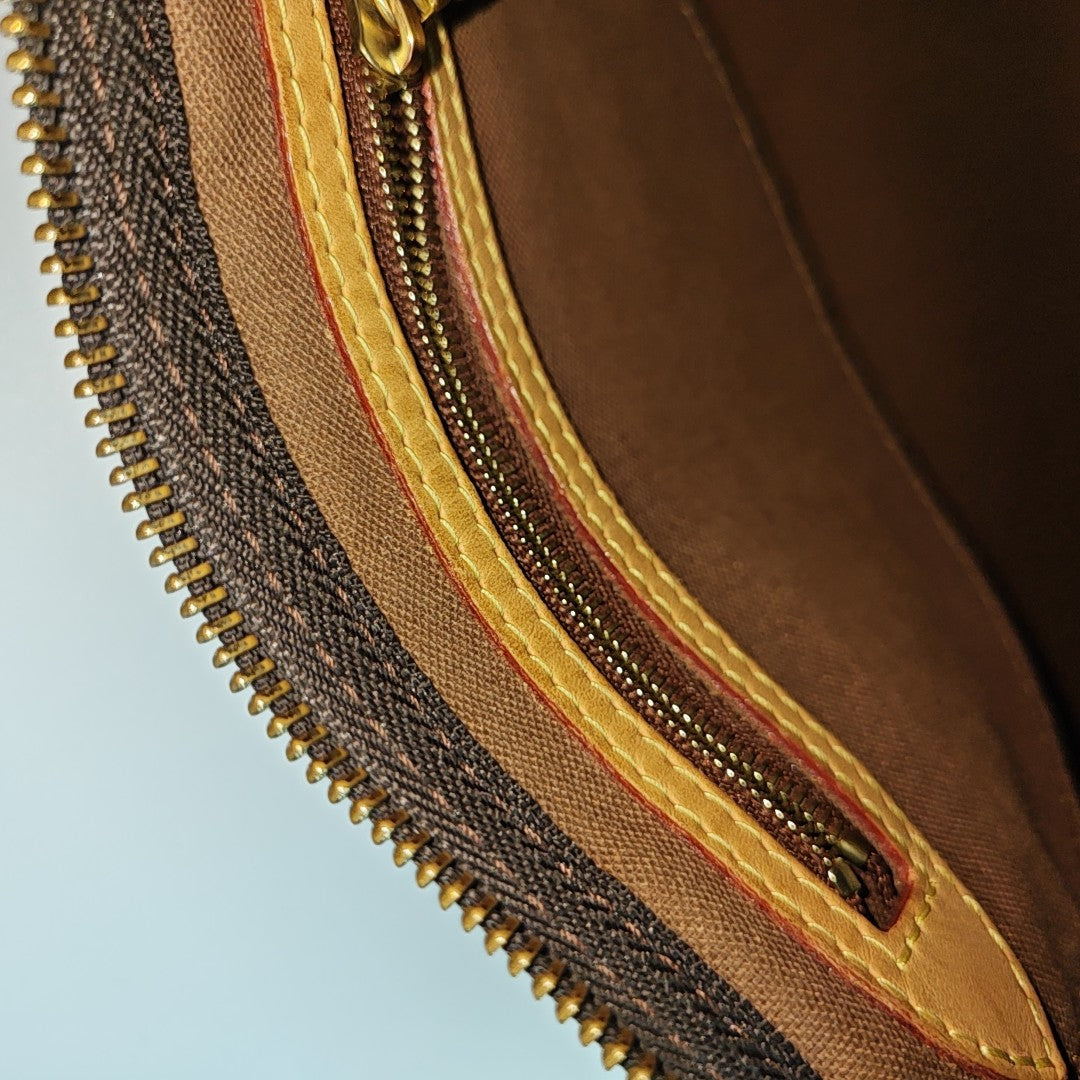 SPEEDY 25 Monogram Coated Canvas Brown