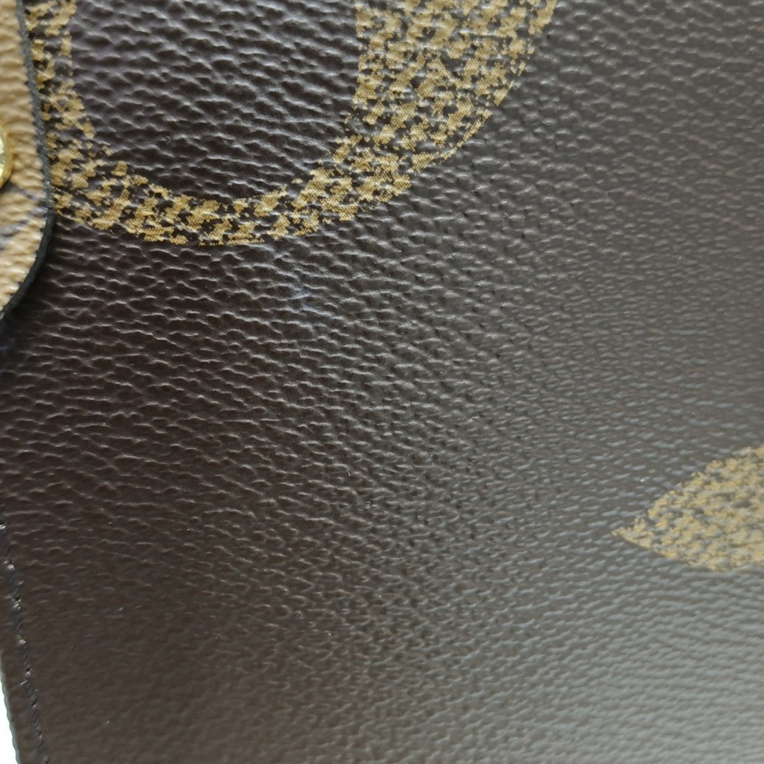ONTHEGO MM Monogram Coated Canvas Brown