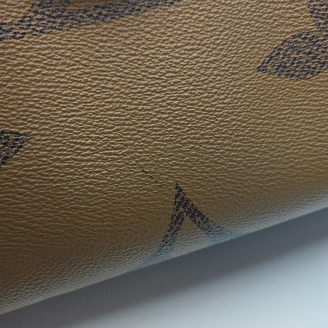 ONTHEGO MM Monogram Coated Canvas Brown