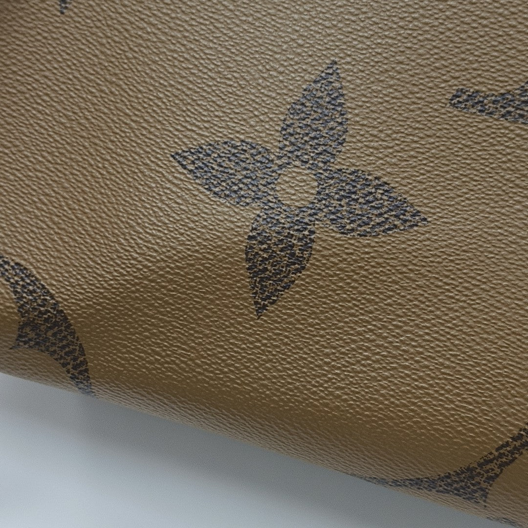 ONTHEGO MM Monogram Coated Canvas Brown