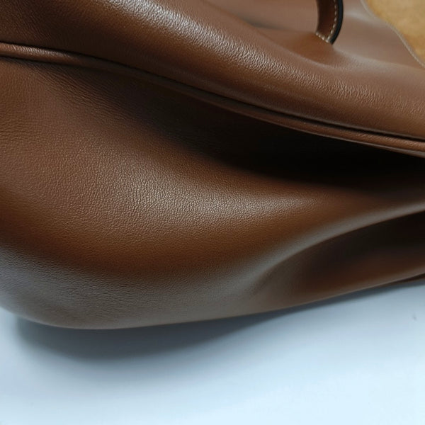 Authenticated pre-owned  16 Medium Calfskin Brown - Top Handle Bag at Looply